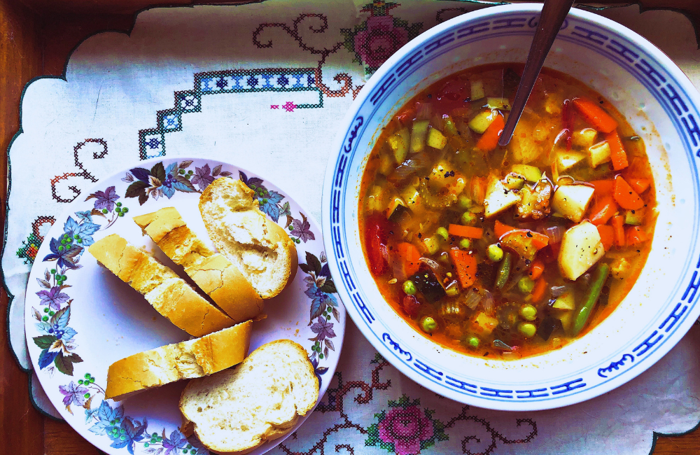 Pip's minestrone soup with crusty bread on a pretty tray