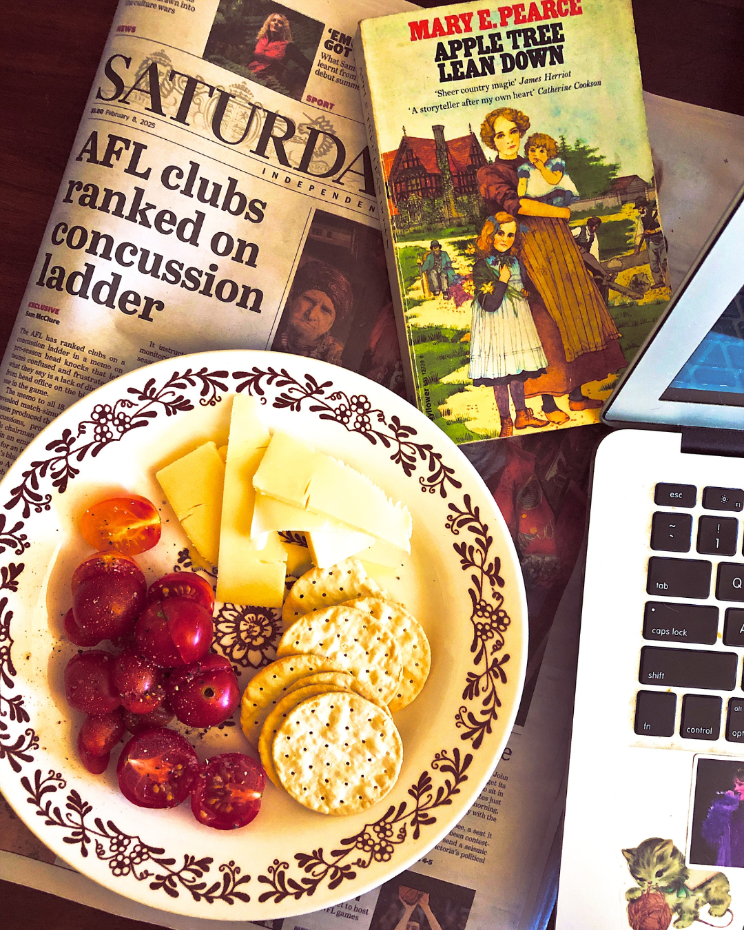 Snacks (cheese, crackers and tomatoes) and books