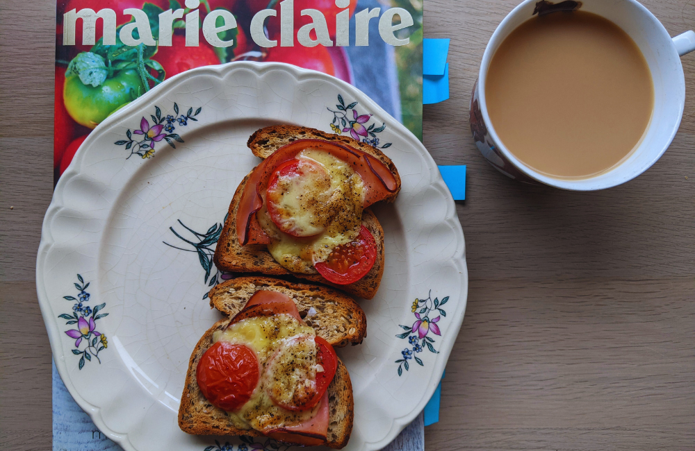 Cheese, tomato and ham on toast with tea and an old Marie Claire cookbook (it's a good one!)