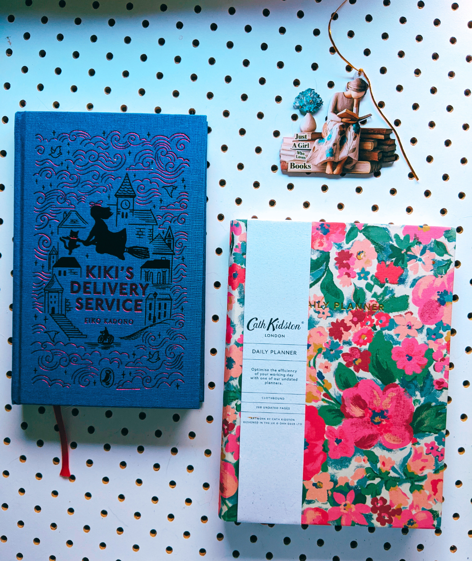 Kiki's Delivery Service book, a Cath Kidston floral covered notebook, a cute bookish ornament.