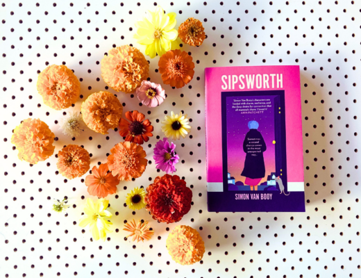 Sipsworth by Simon Van Booy beside an arrangement of flowers from my garden